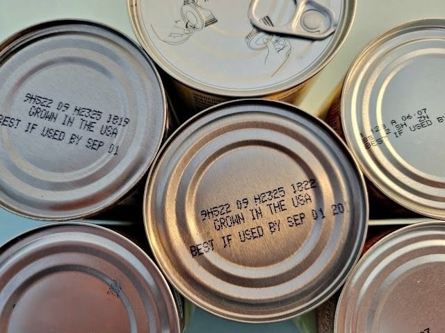 Organized canned food storage with rotation system